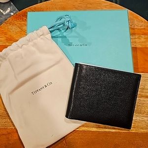 Tiffany & Co. Black textured leather billfold wallet.